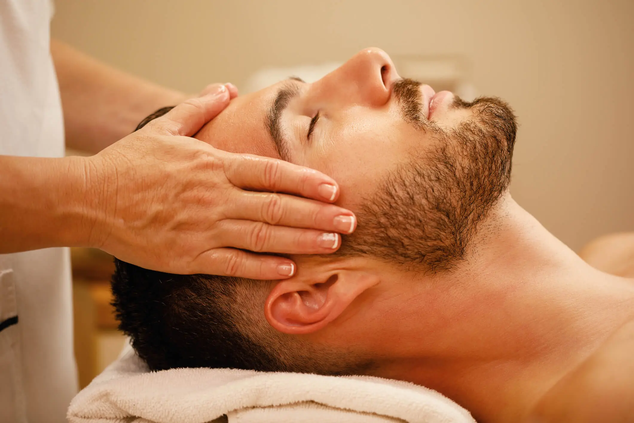 Man receiving head massage